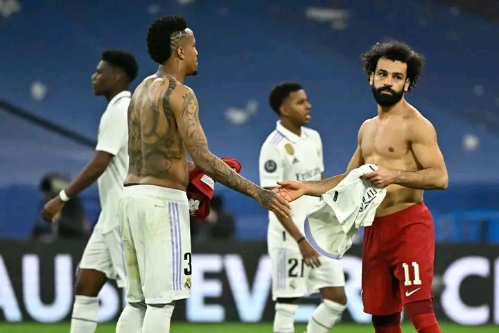 Salah exchanges his shirt with Militao